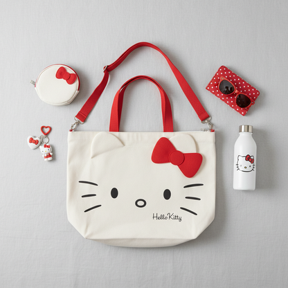 Overhead flat lay of white Hello Kitty bag with accessories