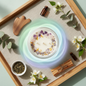Overhead flat lay of tranquil healing aura jar candle with healing crystals