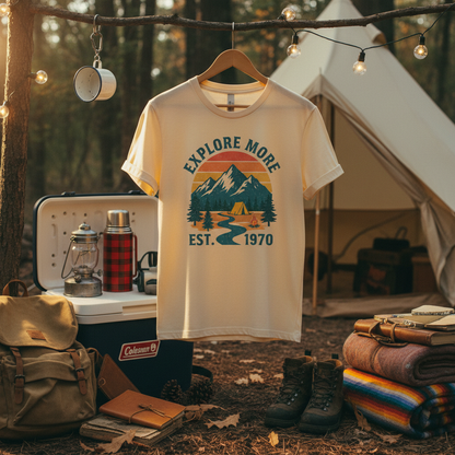 Retro adventure t-shirt on hanger with vintage camping gear
