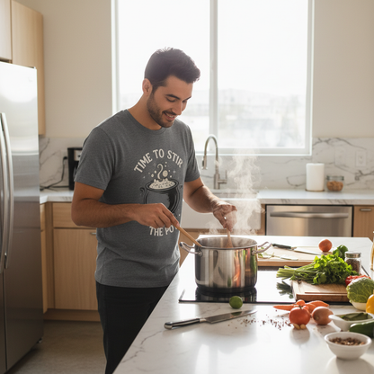 Person wearing time to stir the pot t-shirt while cooking in modern kitchen