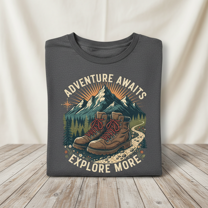 Adventure hiker graphic t-shirt with hiking boots and mountain peaks on wooden surface