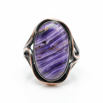 Vibrant purple charoite gemstone ring in metal alloy setting