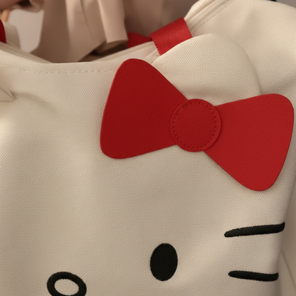 Close-up detail of white Hello Kitty bag showing design details