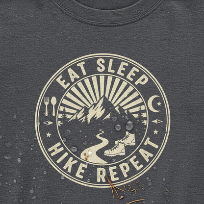 Close-up of eat sleep hike repeat t-shirt showing hiking lifestyle design